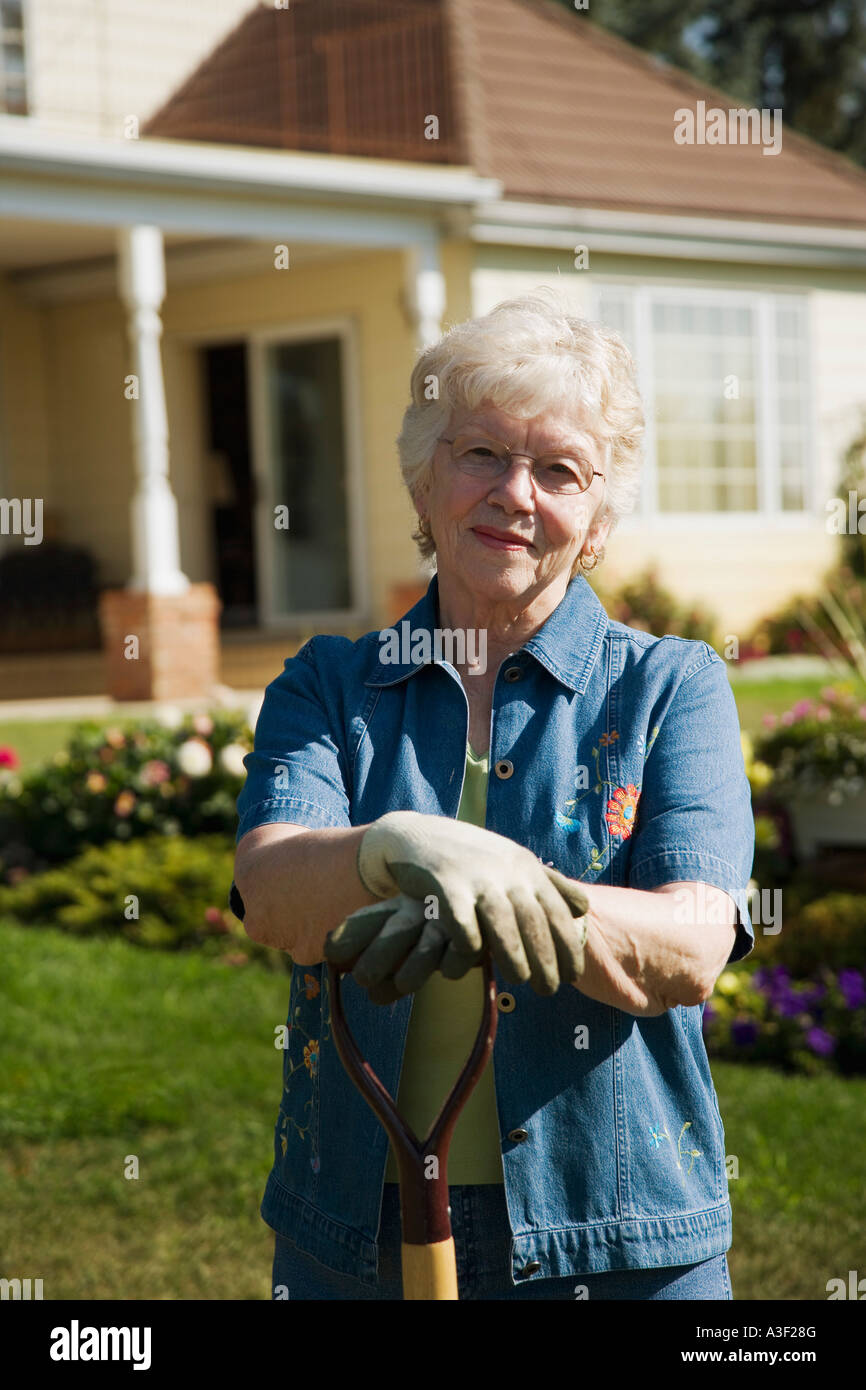 Senior woman gardening Stock Photo - Alamy