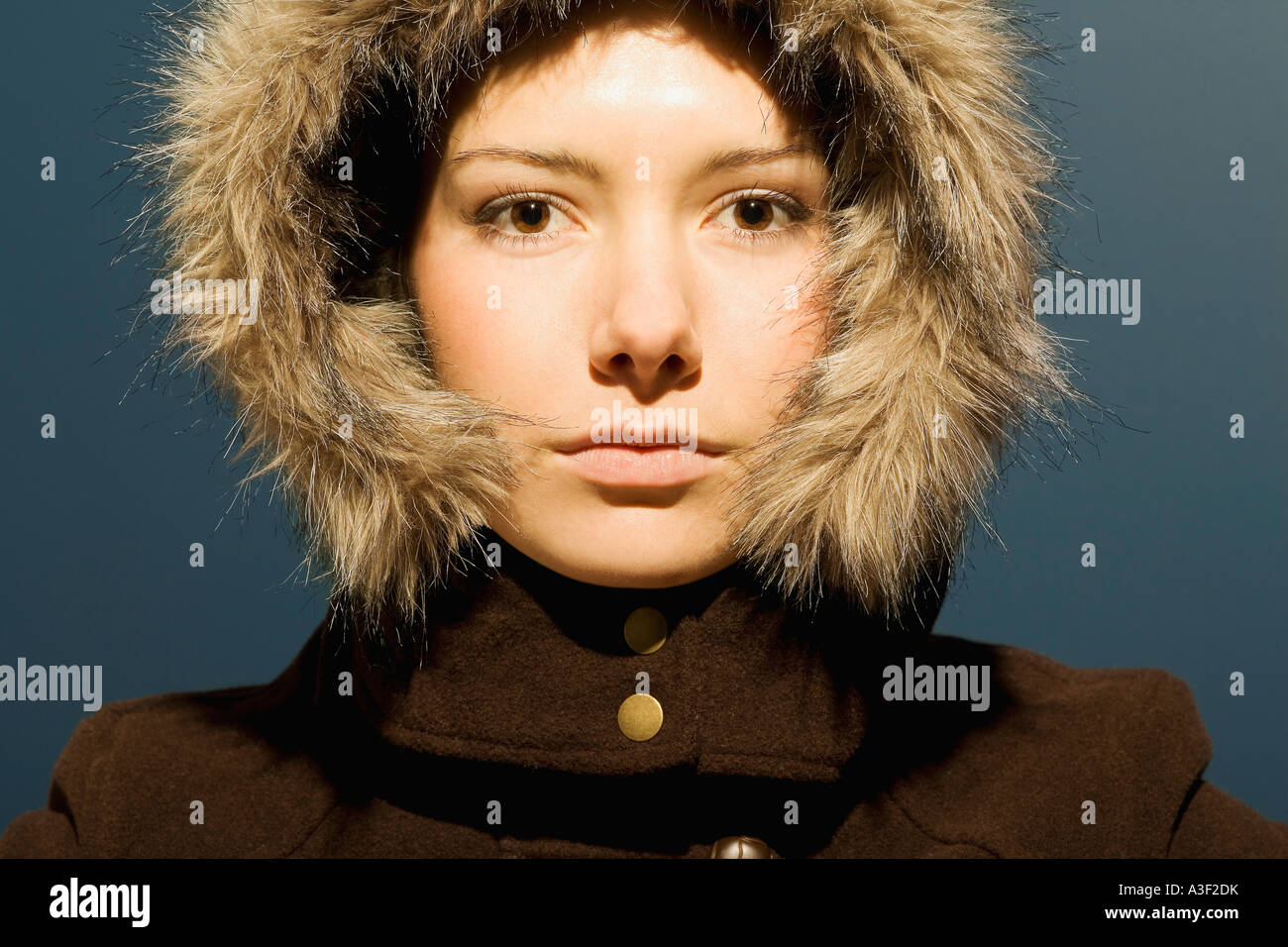 Young woman with winter coat Stock Photo