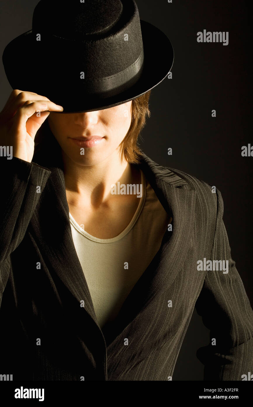 Woman in suit and hat Stock Photo - Alamy