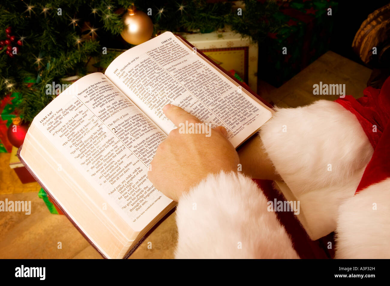 Santa reading the Bible Stock Photo Alamy