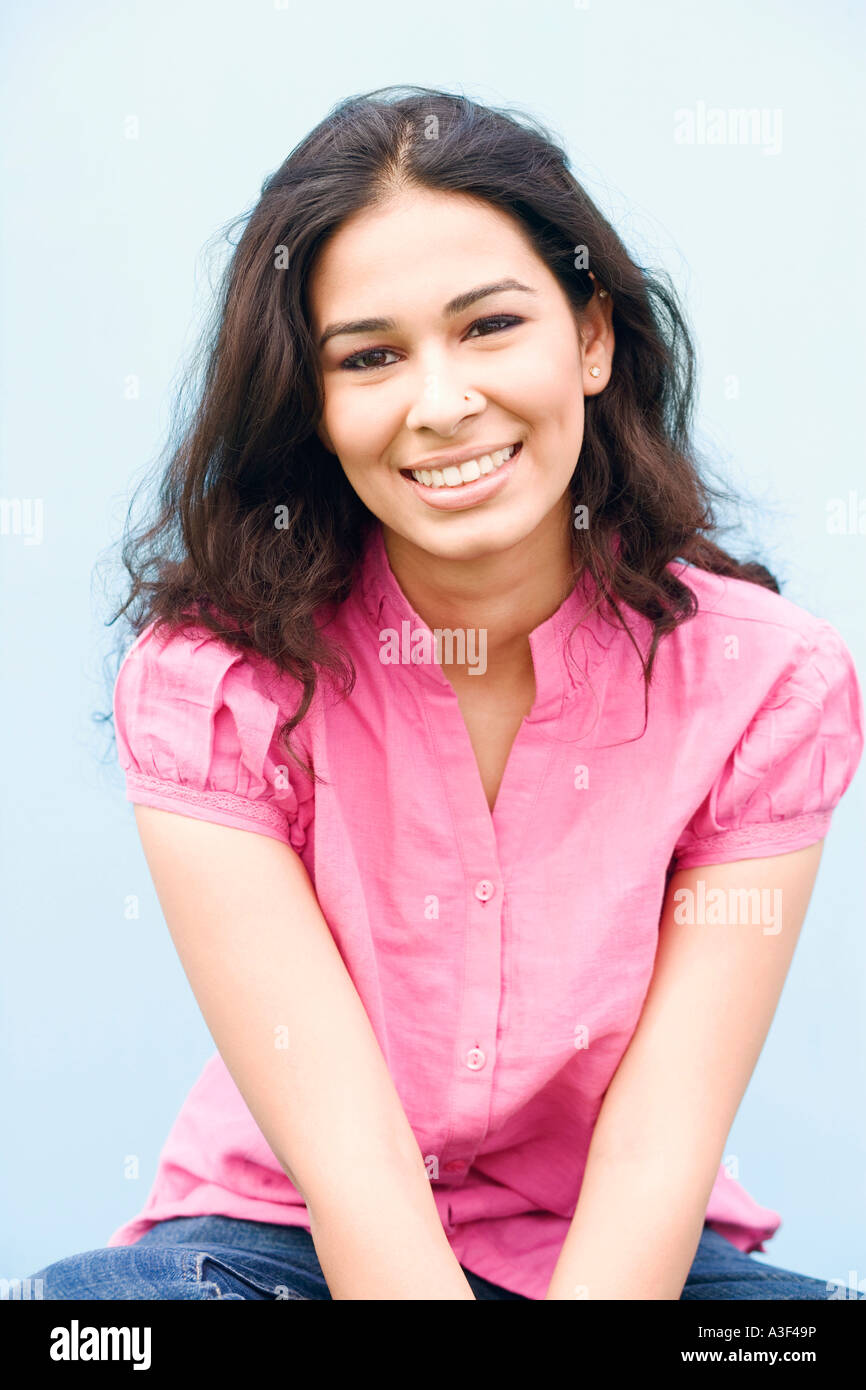 Close-up of a young woman smiling Stock Photo - Alamy