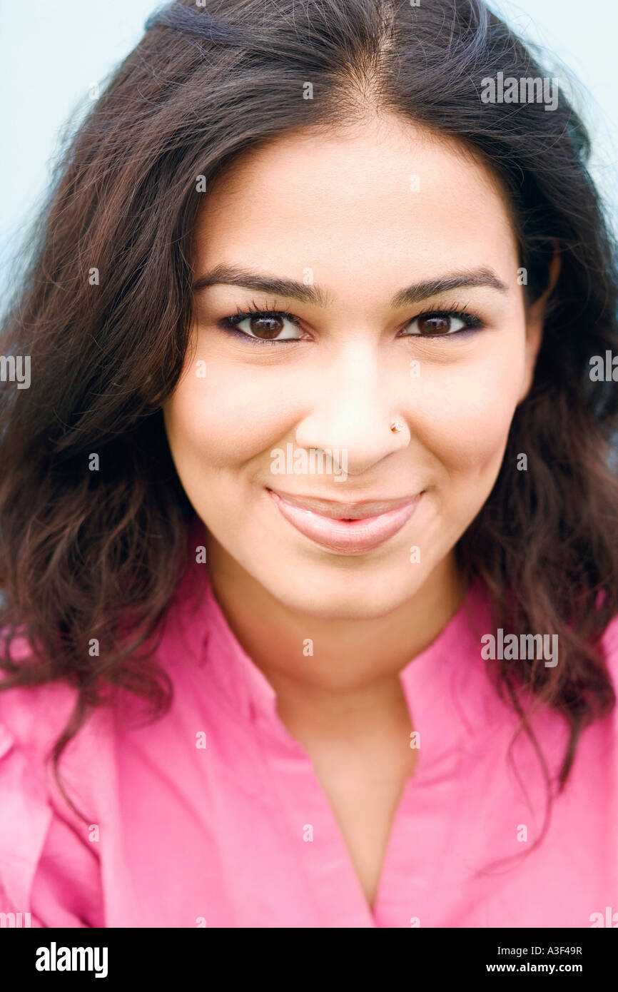 Close-up of a young woman smiling Stock Photo - Alamy