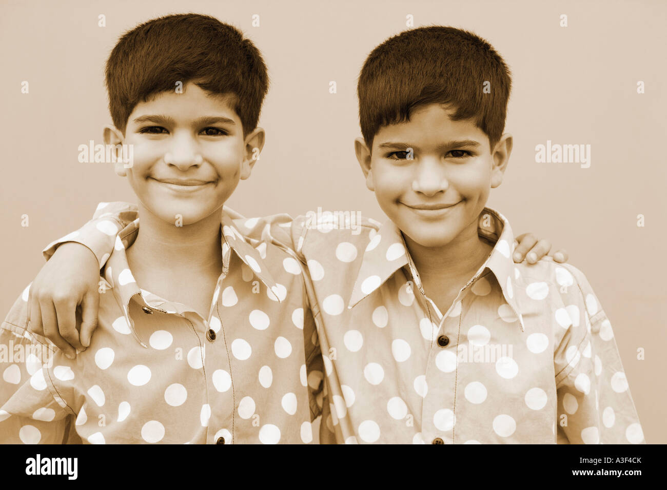 Two boys arms around each other hi-res stock photography and images - Alamy