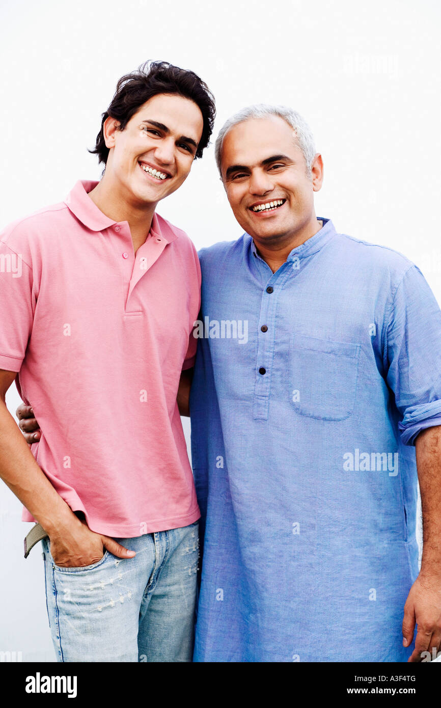 Portrait of a young man smiling with a young man Stock Photo - Alamy