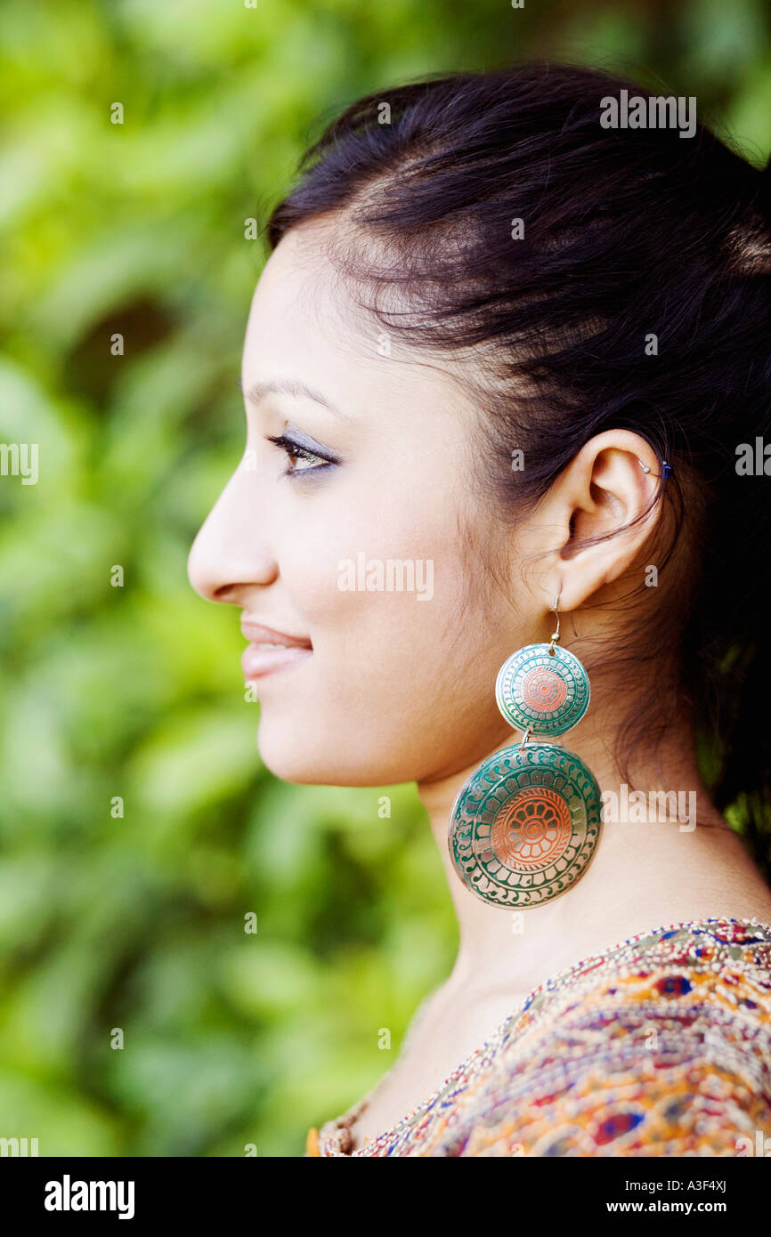 Close-up of a young woman smiling Stock Photo - Alamy