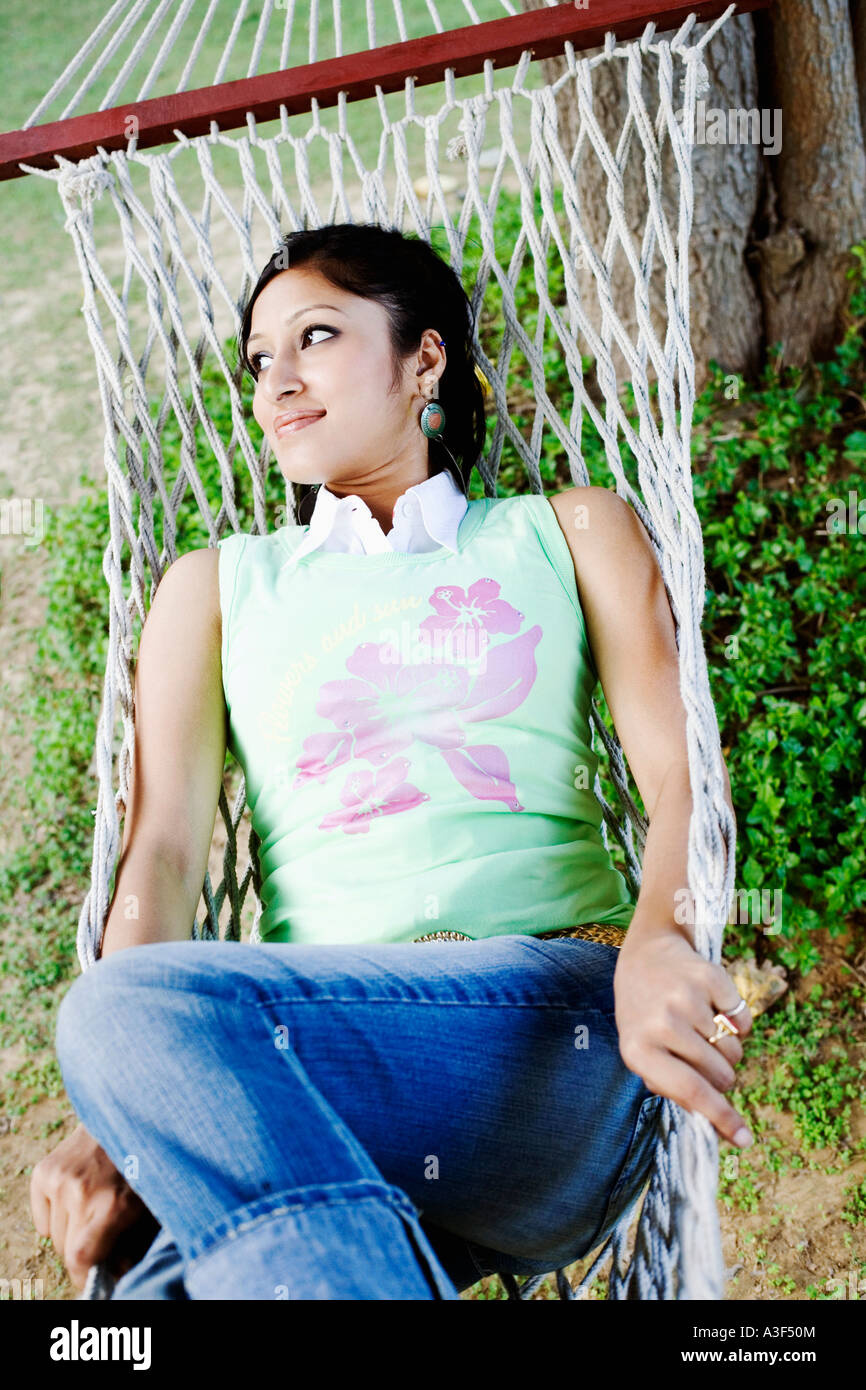 High angle view of a young woman lying in a hammock Stock Photo - Alamy