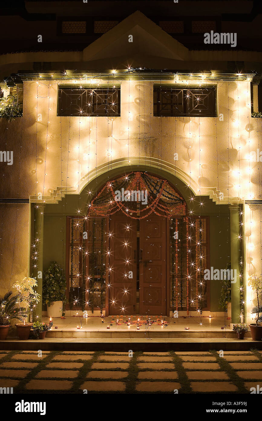 Decorated entrance of a house lit up at night Stock Photo - Alamy
