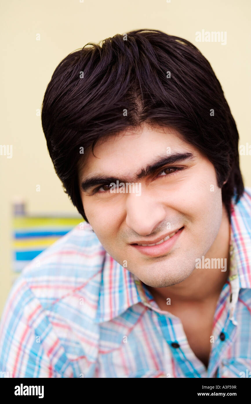 Portrait of a young man smiling Stock Photo - Alamy