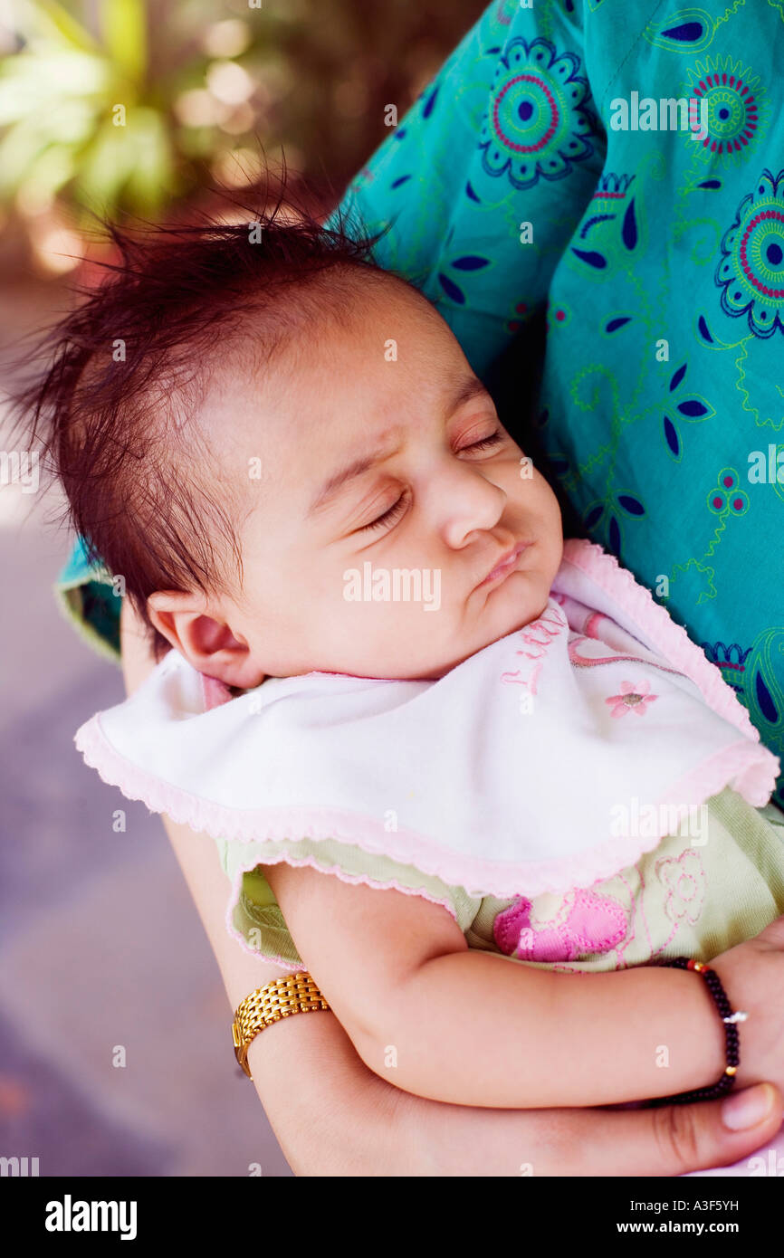 Indian woman carrying baby on hi-res stock photography and images - Alamy