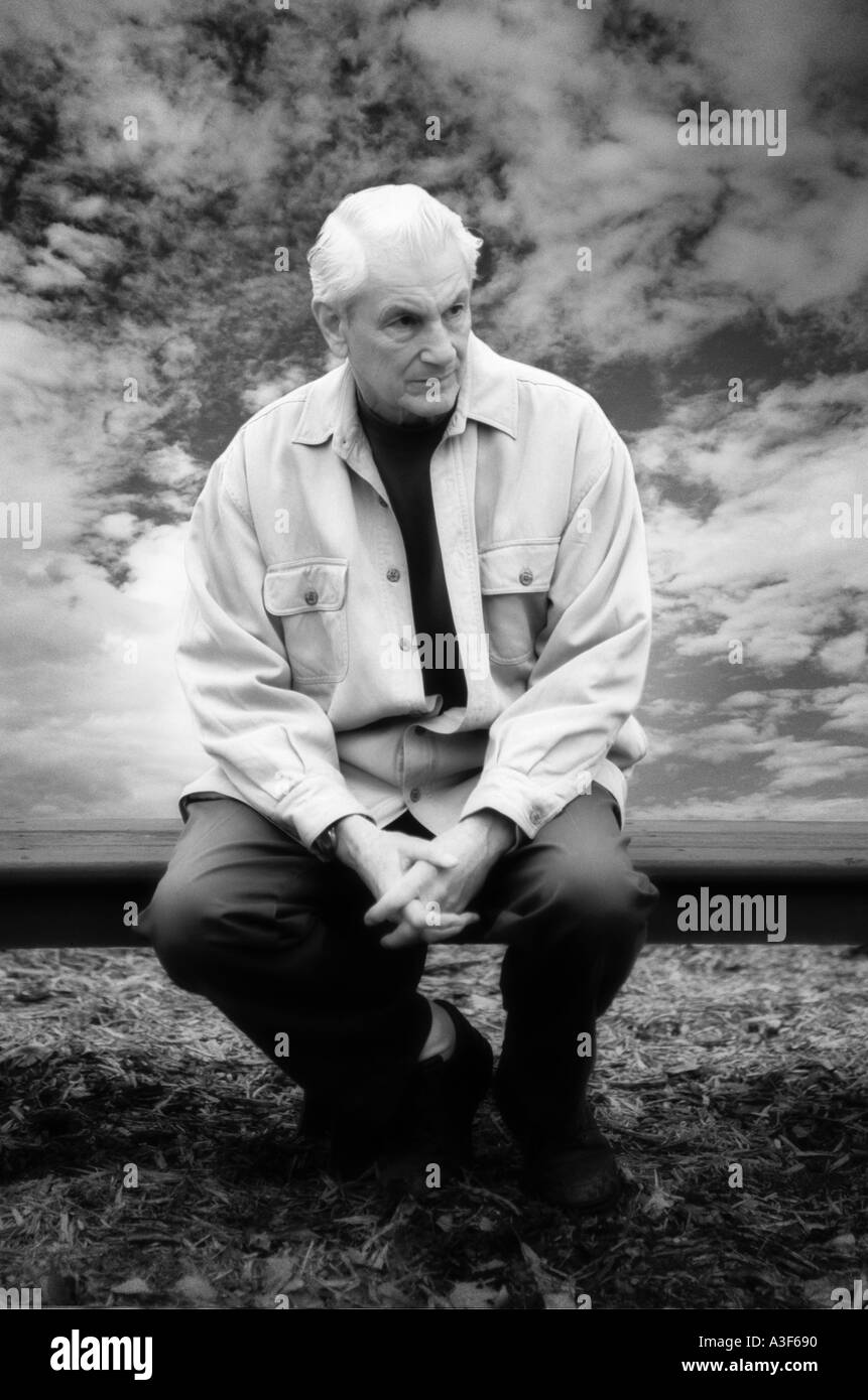 Older man sitting on bench Black and White Stock Photos & Images - Alamy