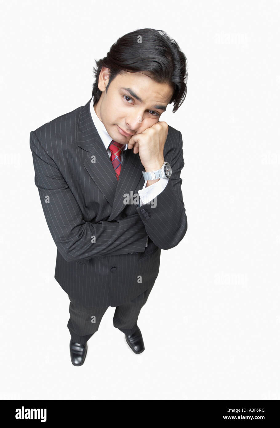 Indian business man thinking Cut Out Stock Images & Pictures - Alamy