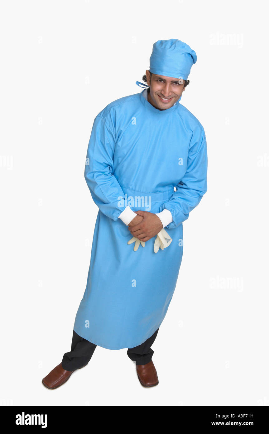 Portrait of a male surgeon smiling Stock Photo - Alamy