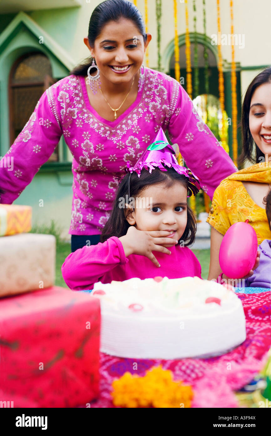 Three people celebrating a birthday party Stock Photo - Alamy