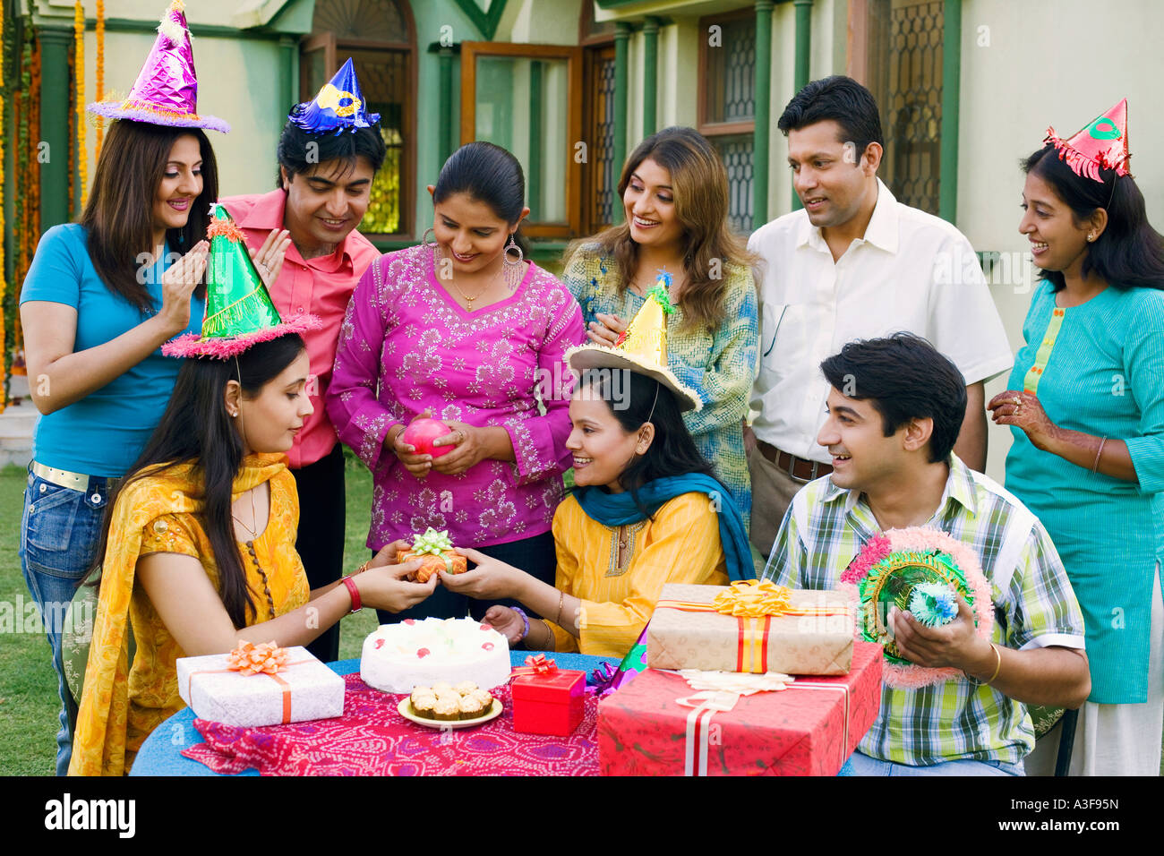 Group of people celebrating a birthday party Stock Photo - Alamy