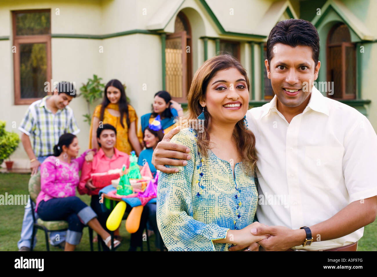 Portrait of a mid adult man and a young woman smiling Stock Photo - Alamy
