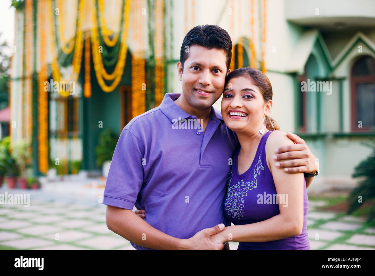 Portrait of a mid adult man with a young woman smiling Stock Photo - Alamy