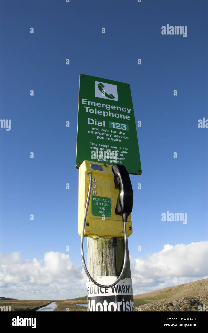 Emergency Telephone on shingle beach North Norfolk UK Stock Photo