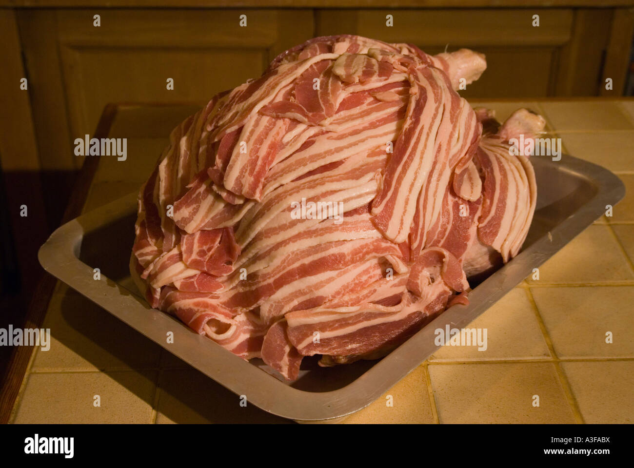 Chirstmas turkey weight 18lbs covered with streaky bacon before placing