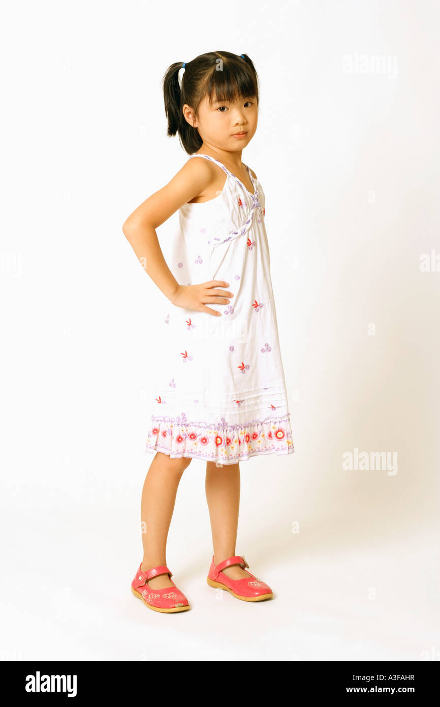 Portrait of a girl standing with her hand on her hip Stock Photo - Alamy