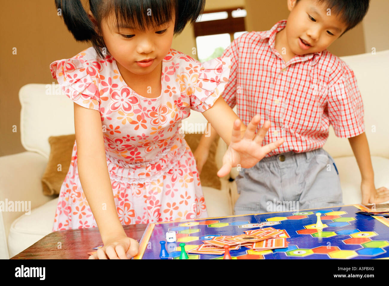 Close-up of a boy playing with his sister Stock Photo
