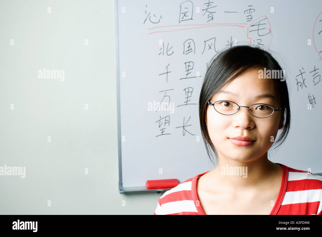 Portrait of a young woman in the classroom Stock Photo - Alamy
