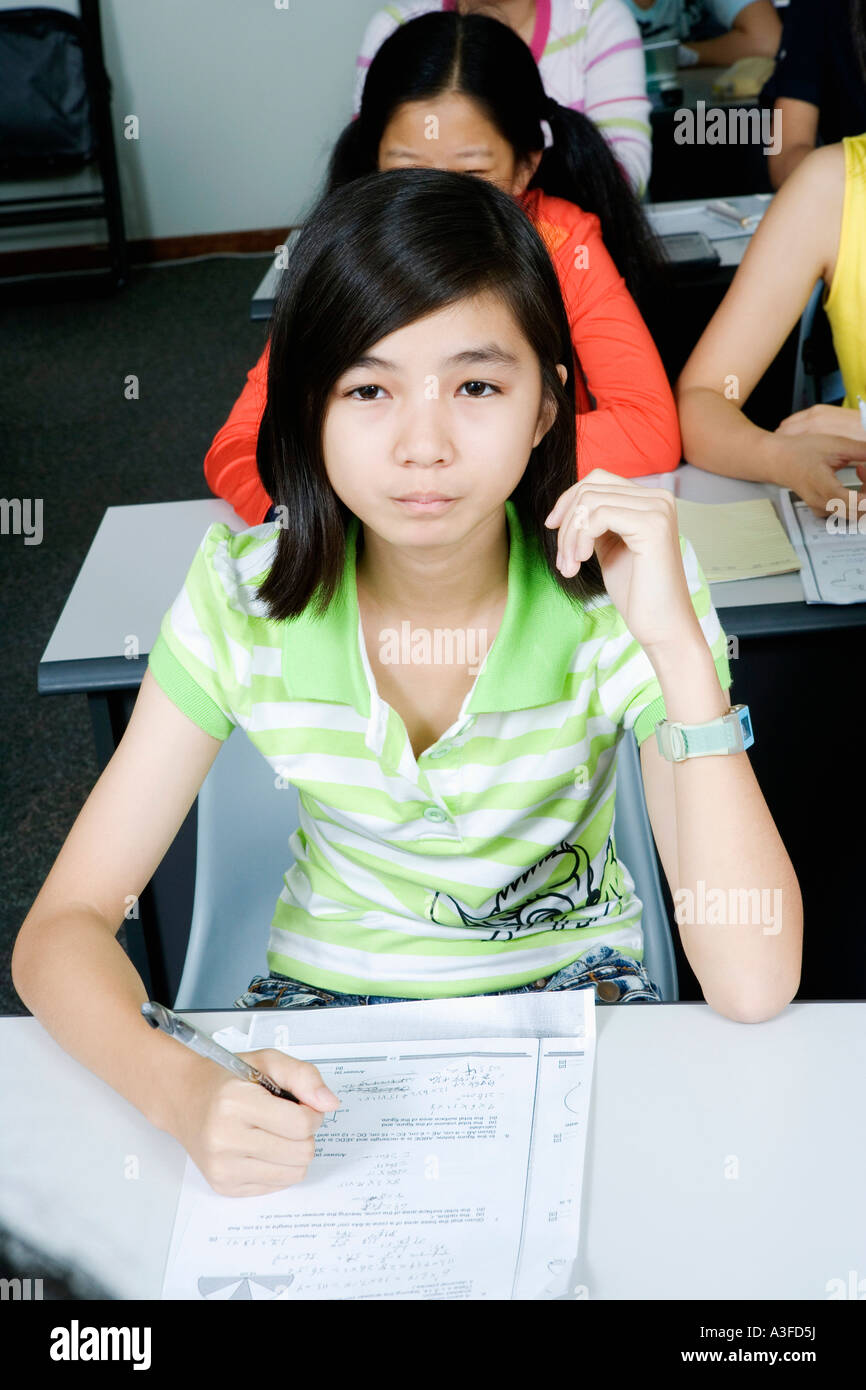 Portrait of a teenage girl sitting in the classroom Stock Photo - Alamy