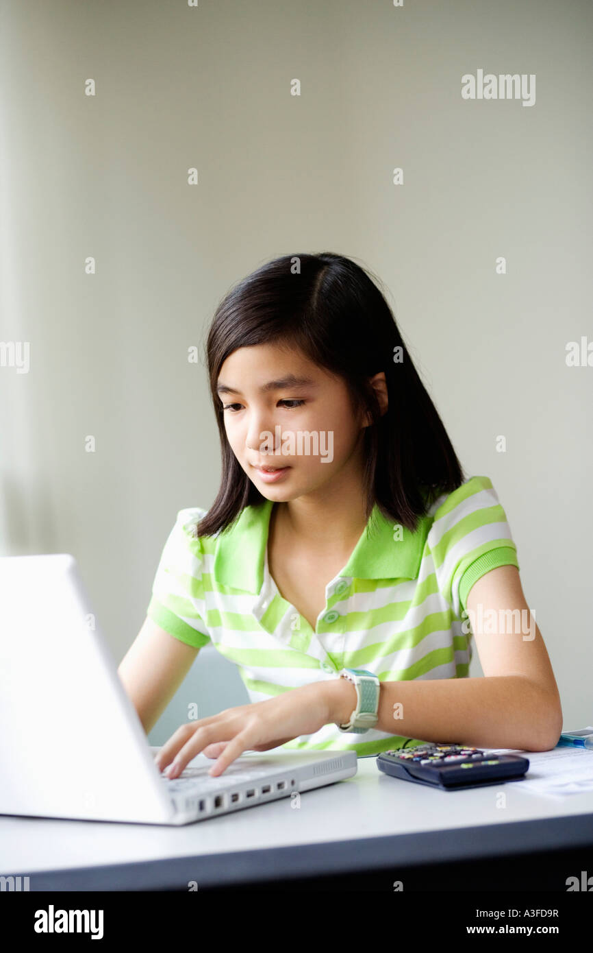 Close-up of a girl using a laptop Stock Photo