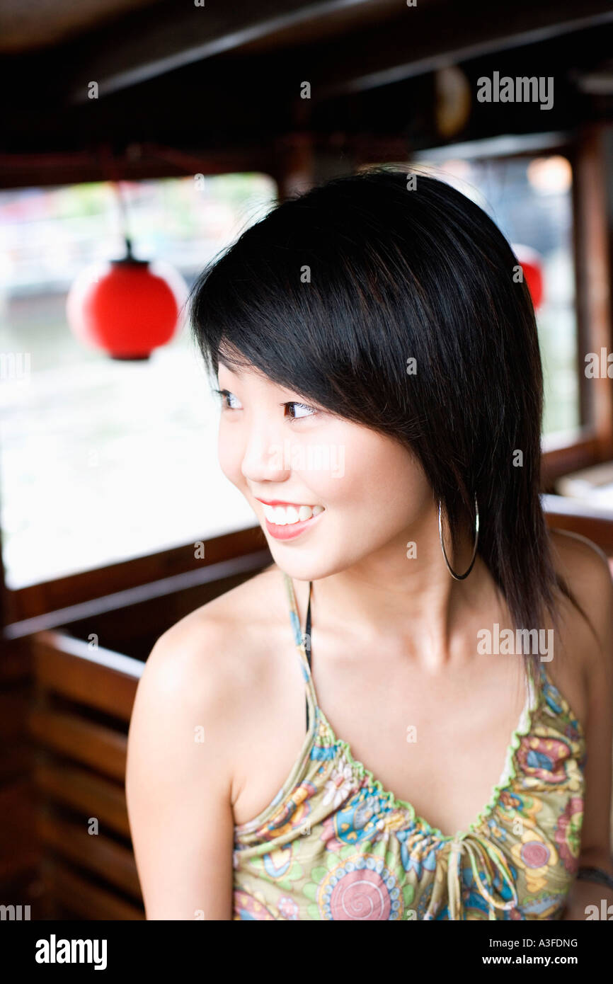 Close-up of a young woman smiling Stock Photo - Alamy