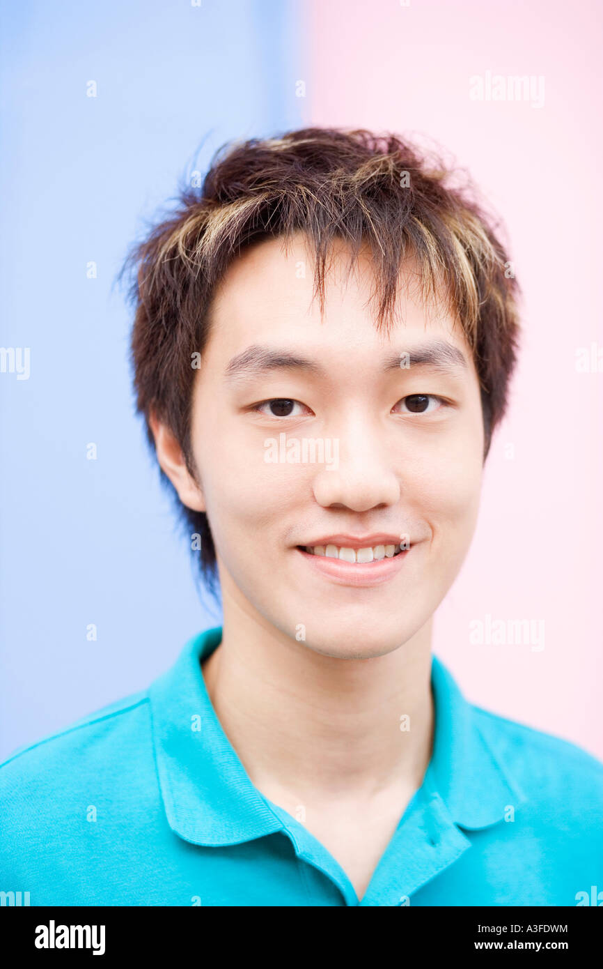 Portrait of a young man smiling Stock Photo - Alamy