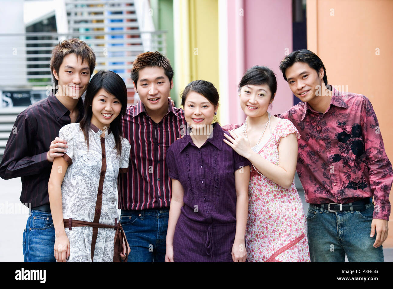 Portrait of a group of people standing together and smiling Stock Photo