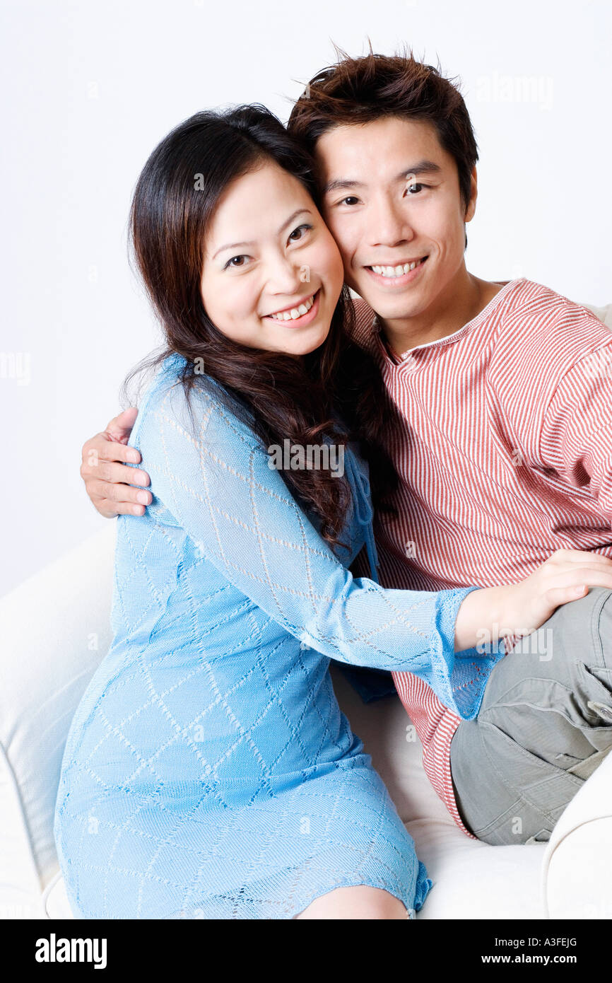 Portrait of a mid adult man and a young woman smiling Stock Photo - Alamy