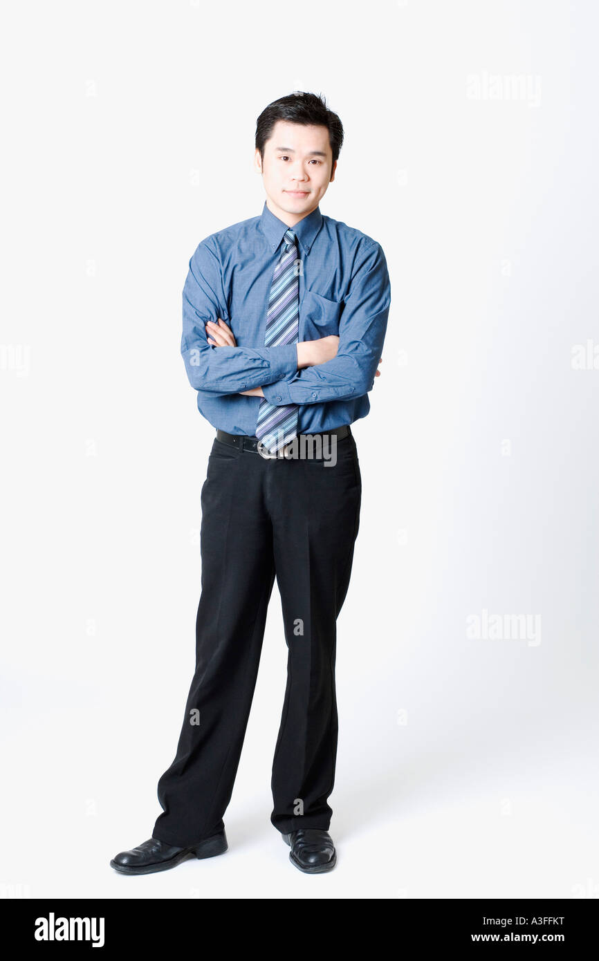 Portrait of a businessman standing with his arms crossed Stock Photo ...