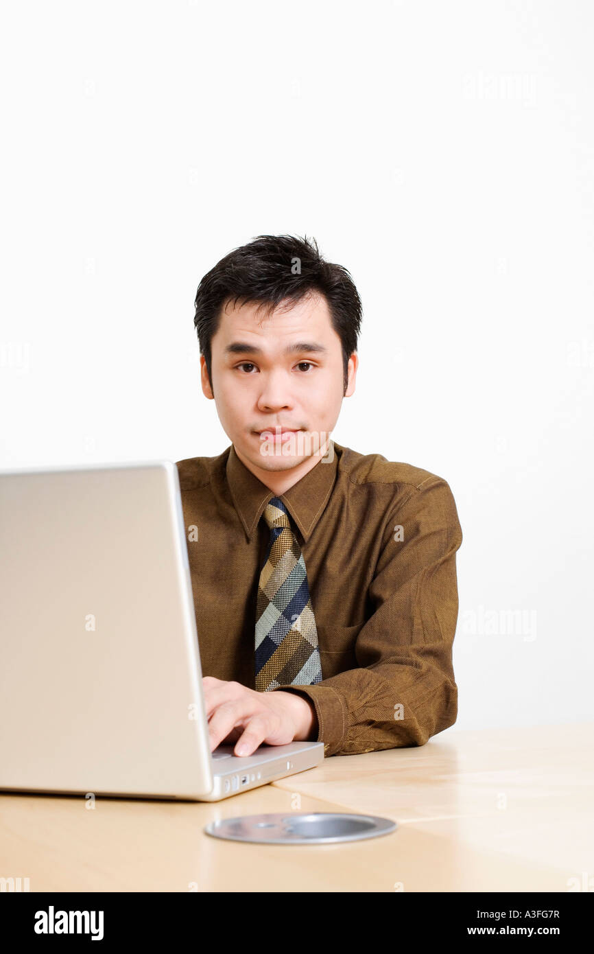 Portrait of a businessman using a laptop Stock Photo