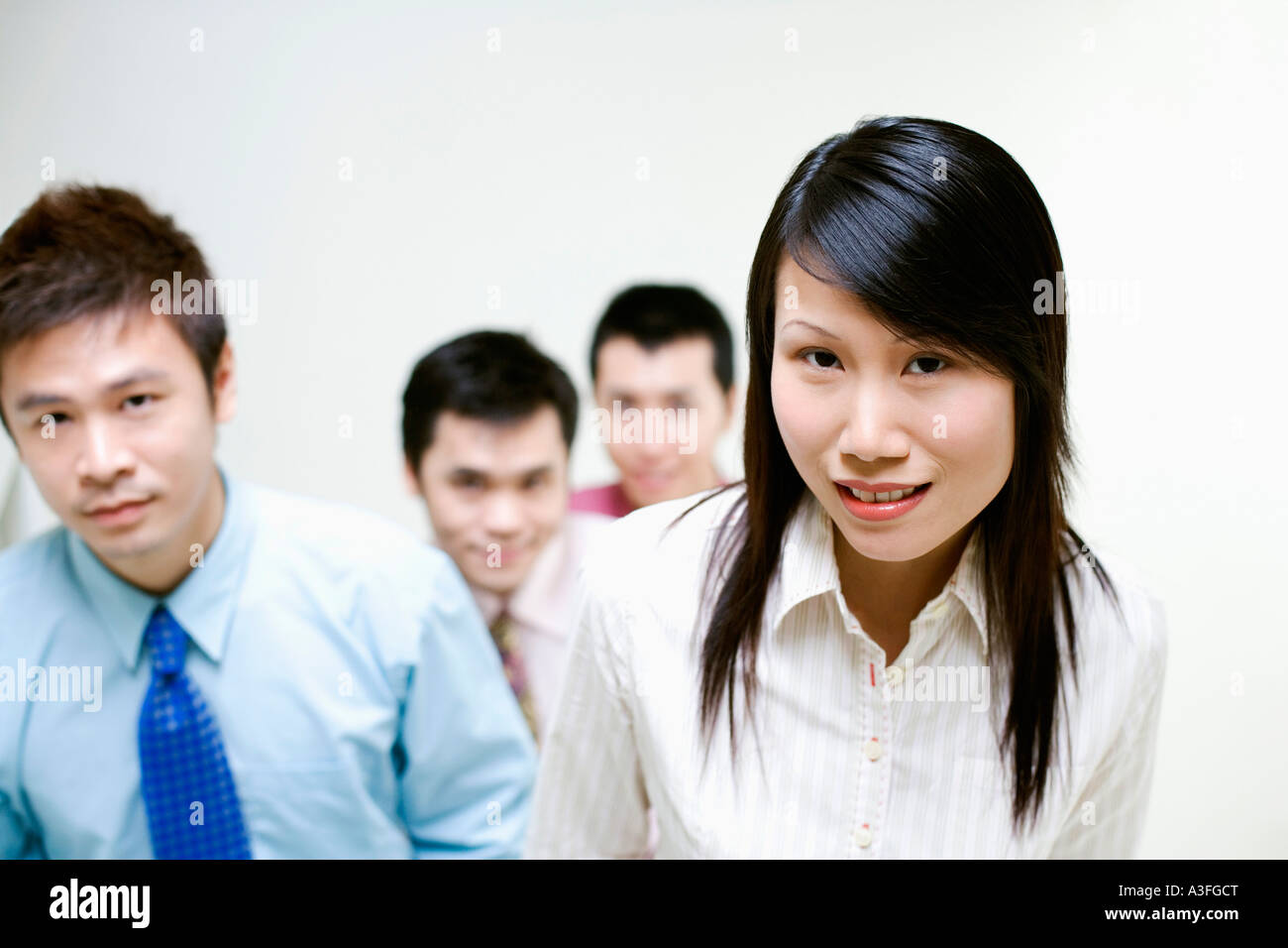 Portrait of business executives standing together Stock Photo - Alamy