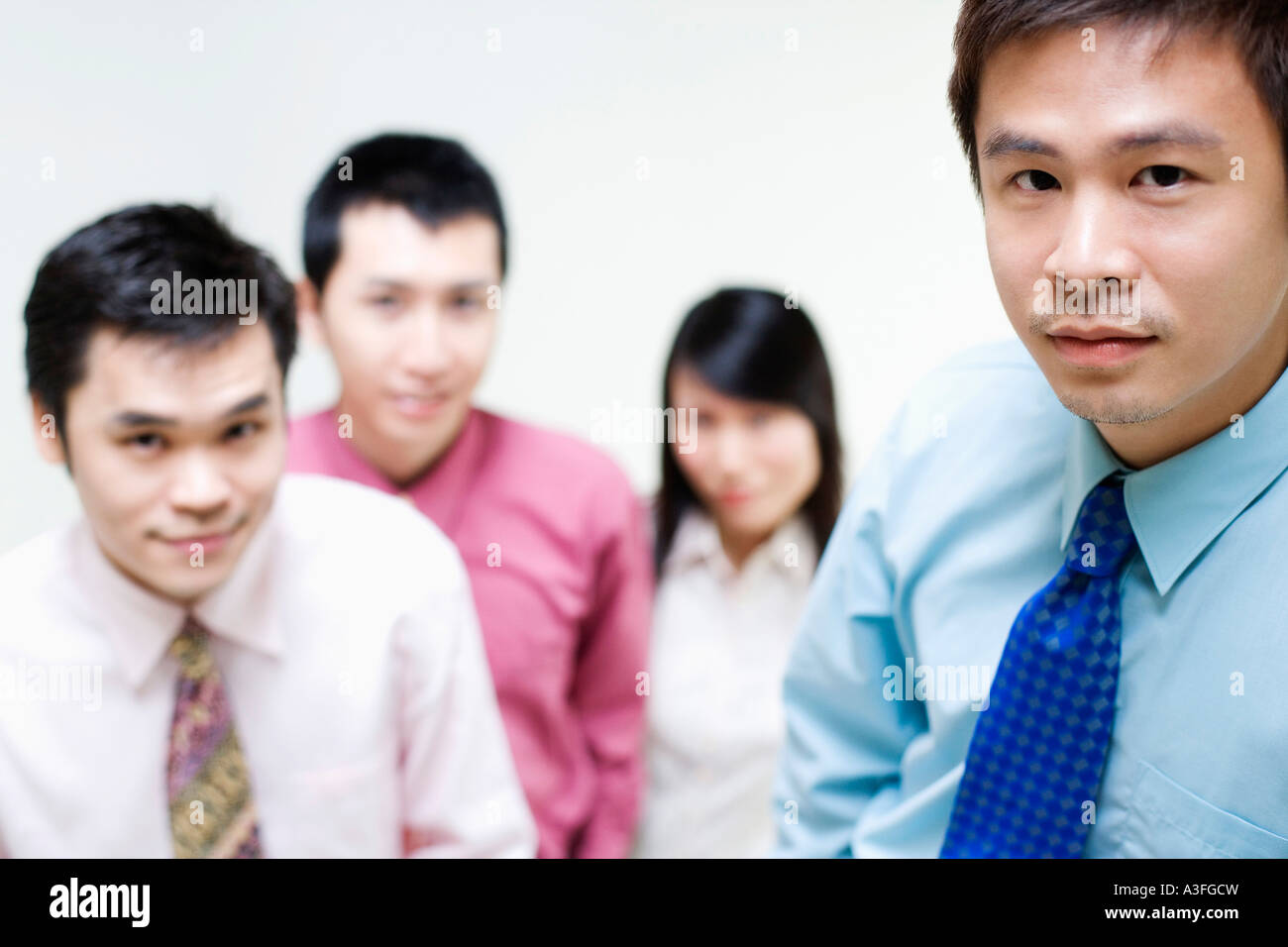 Portrait of business executives standing together Stock Photo - Alamy