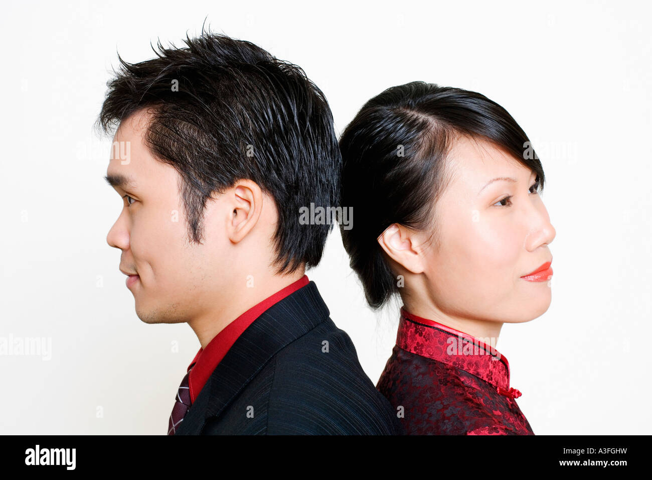 Side profile of a mid adult man and a young woman smiling Stock Photo ...