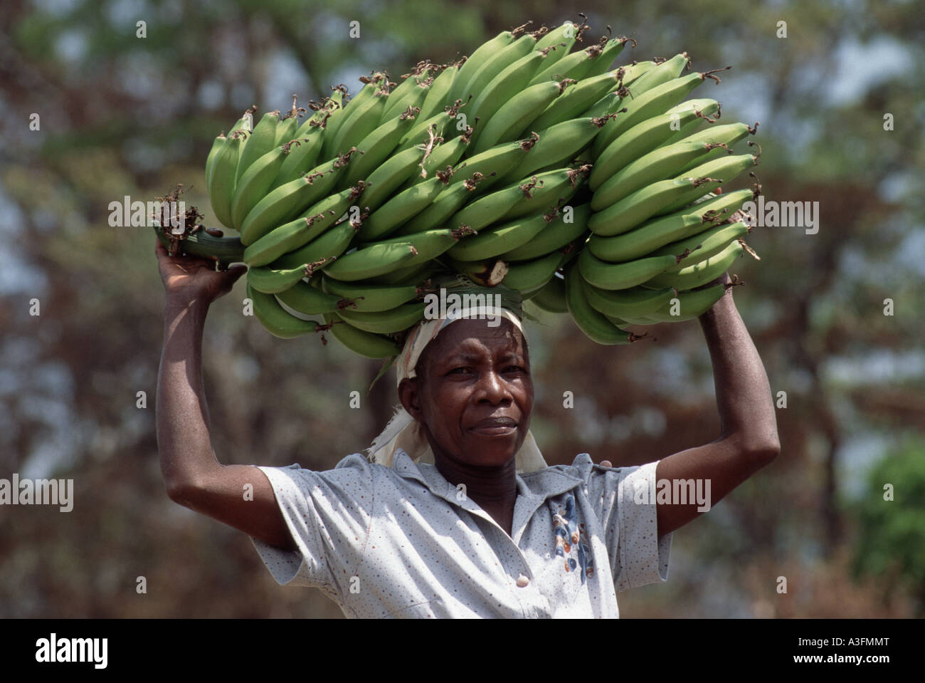 Bananas on head hi-res stock photography and images - Alamy