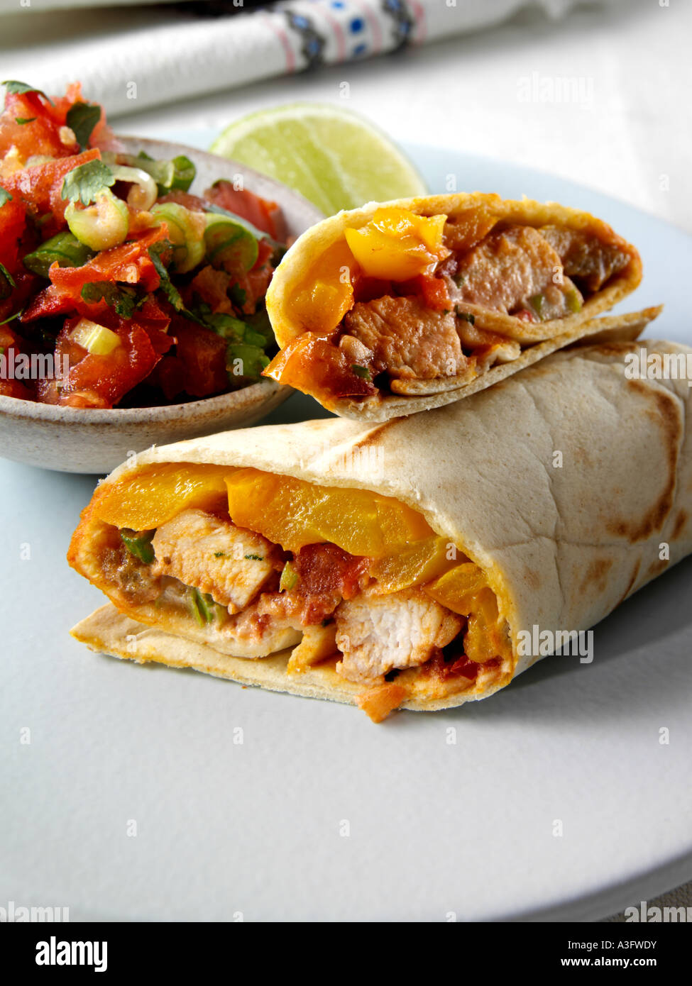 Individual portion mexican marinated chicken fajitas hires stock