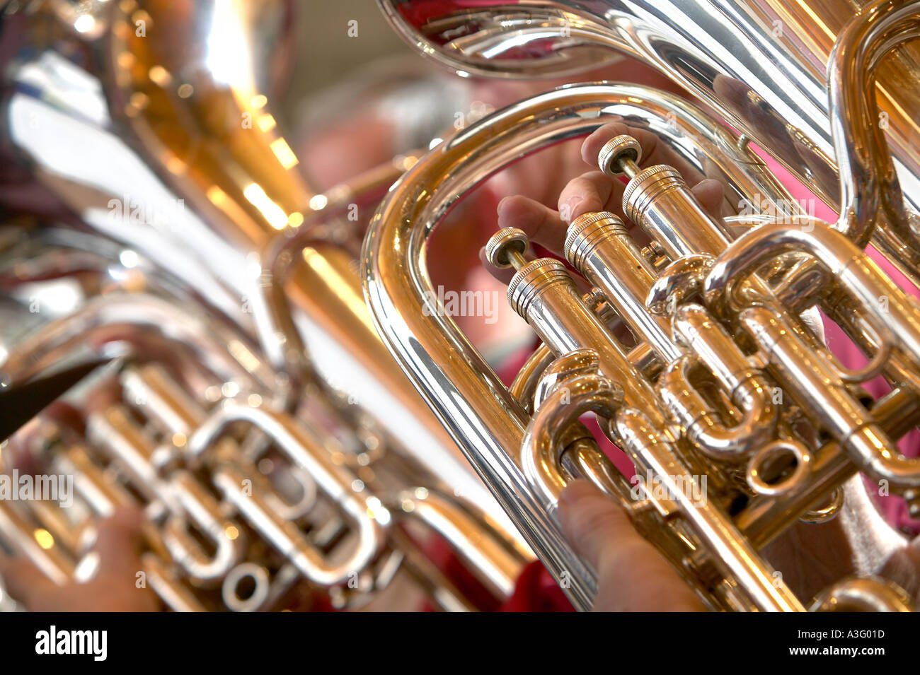 baritone horn brass instrument with fingers on 3 valves Stock Photo