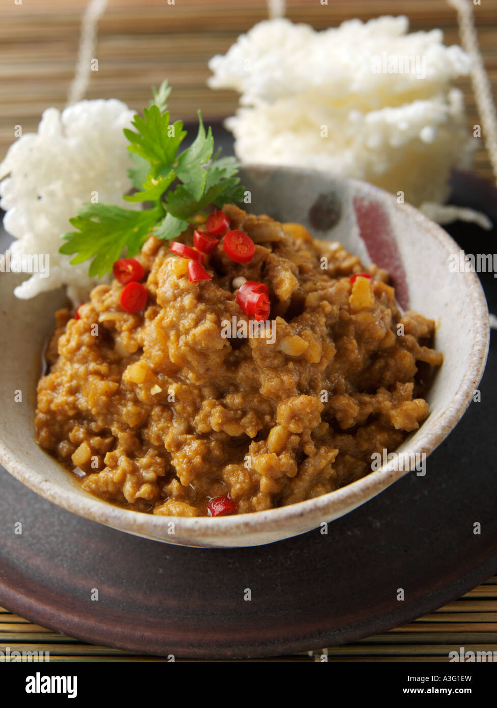 Individual portion thai peanut sauce rice cakes hires stock