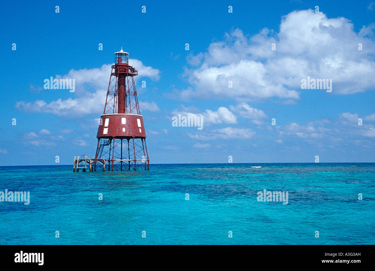 A VIEW OF CLEAR BLUE WATER CLOUDS AND CARYSFORT LIGHTHOUSE KEY LARGO