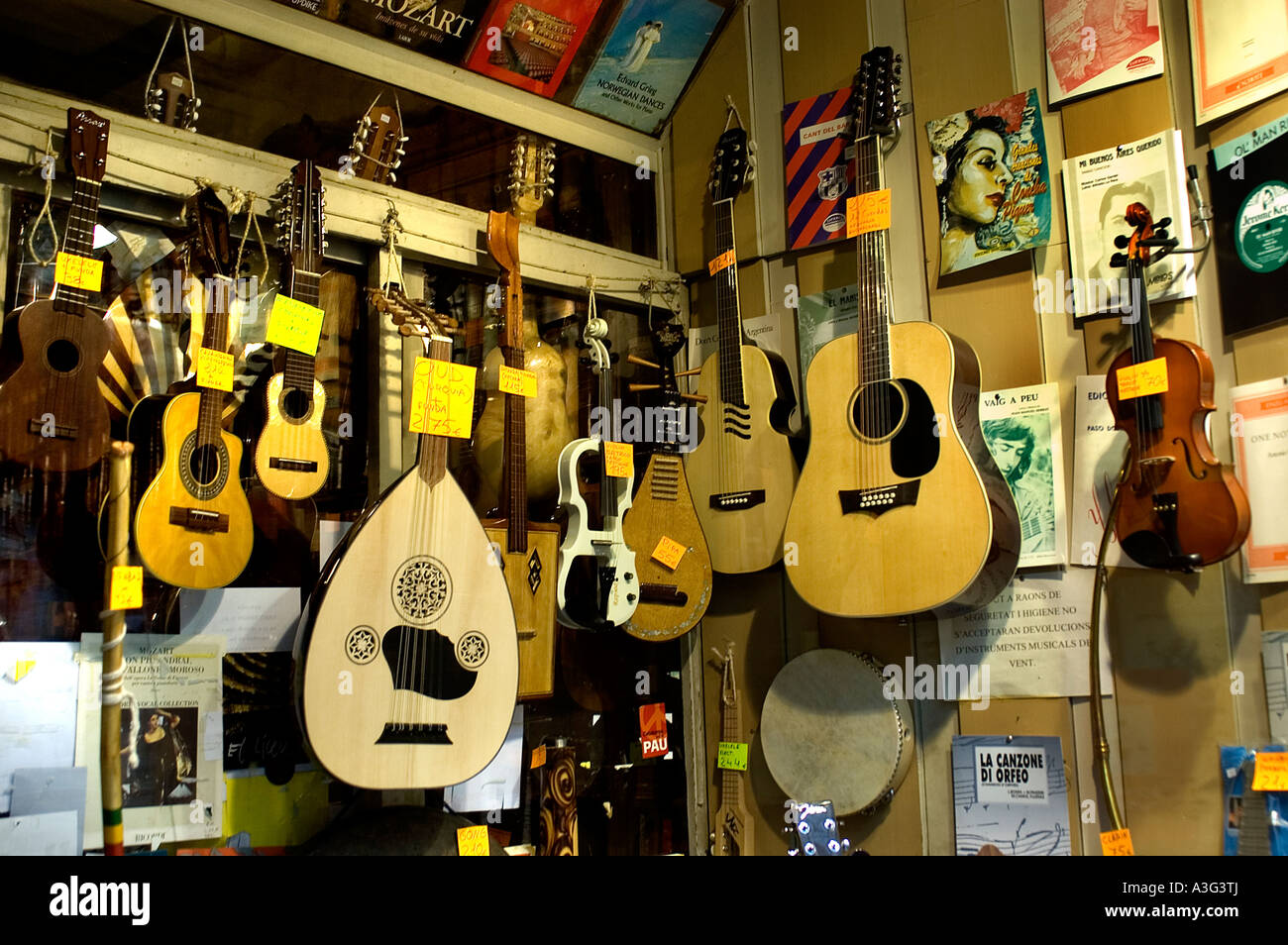 Music gitar violin seller musical instrument Barcelona Spain Rambla Stock Photo