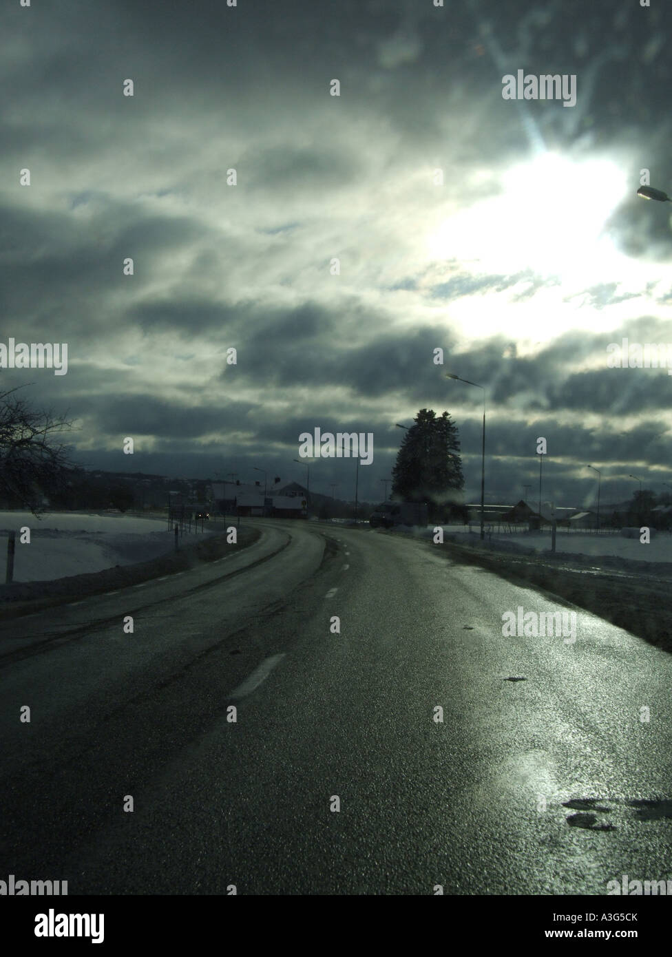 quiet road with stormy sky Stock Photo - Alamy