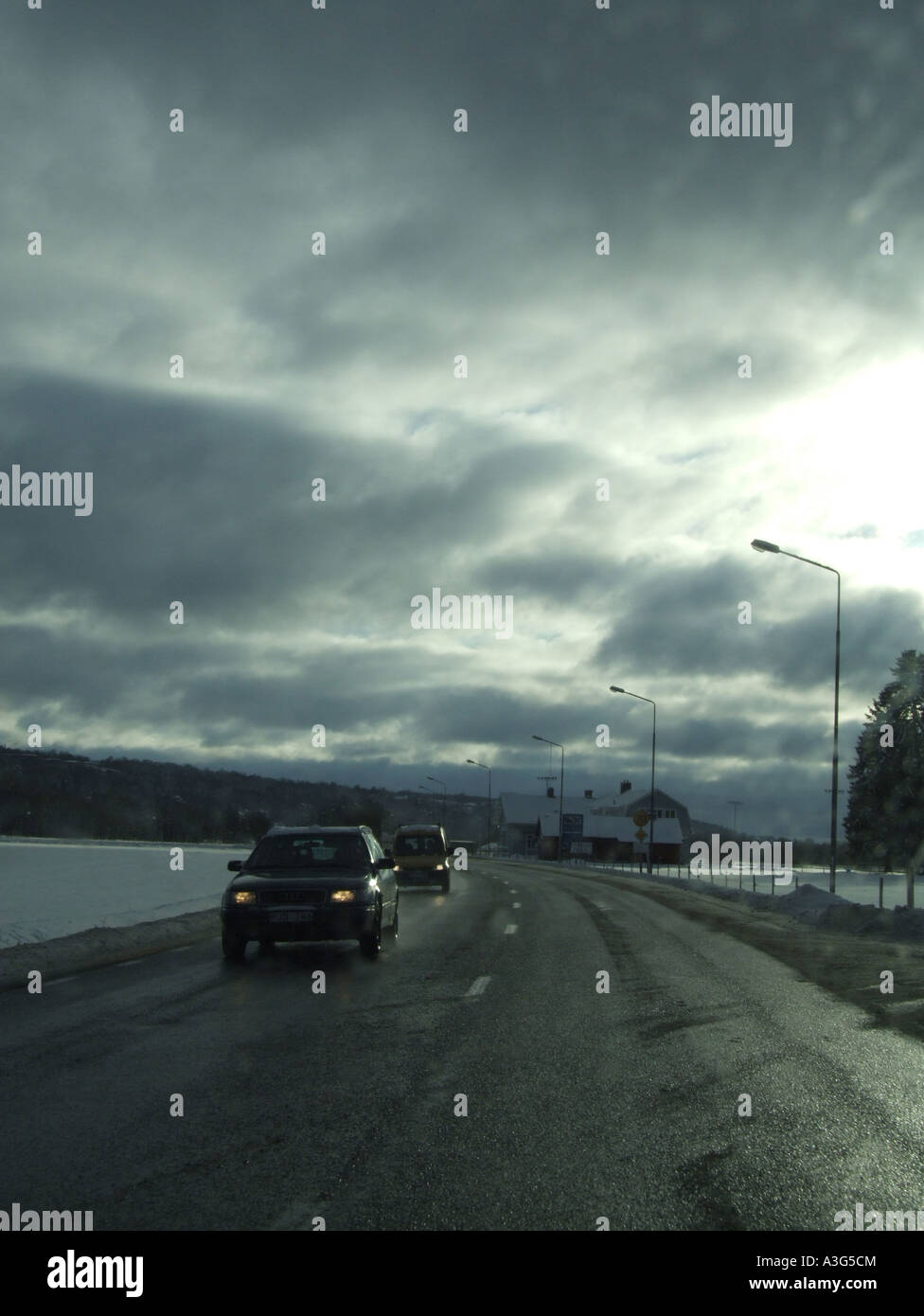 quiet road with stormy sky Stock Photo - Alamy