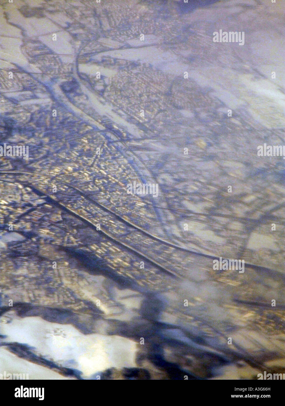 aerial view of a city under snow seen from plane window Stock Photo - Alamy