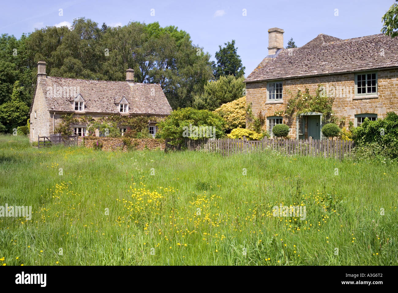 Cottages on the village green in the Cotswold village of Wyck