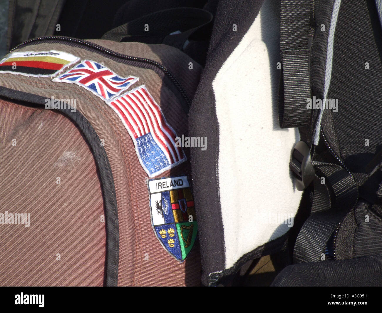 various country nation badges on backpack Stock Photo Alamy