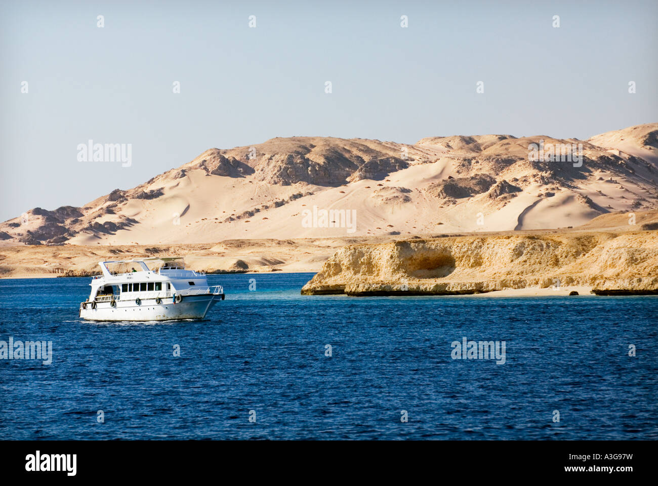 sea and desert island coast waterline deep blue sea RAS MOHAMED Sharm El Sheikh EGYPT sinai Peninsula beach mountain Stock Photo