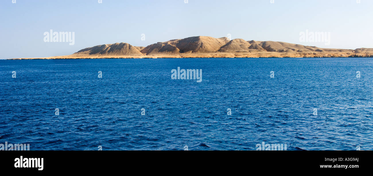 sea and desert island coast waterline deep blue sea RAS MOHAMED Sharm El Sheikh EGYPT sinai Peninsula beach mountain PANORAMA Stock Photo