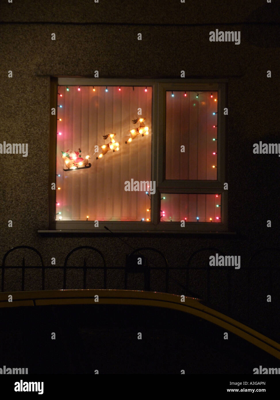 colourful christmas lights in house window Stock Photo Alamy